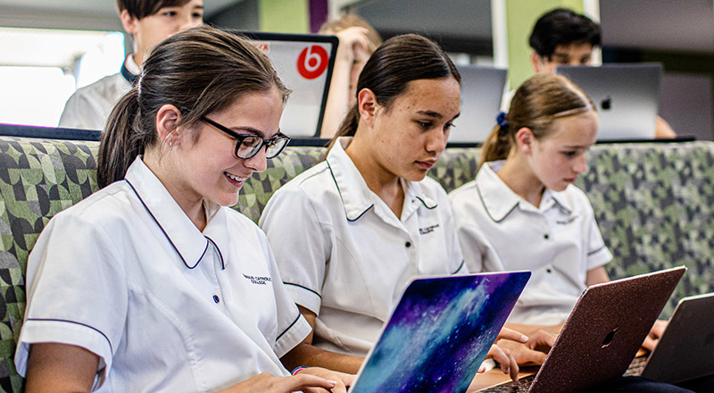Three Emmaus Catholic College Kemps Creek studying