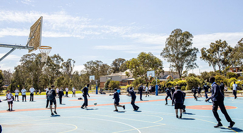 Emmaus Catholic College Kemps Creek students playing basketball